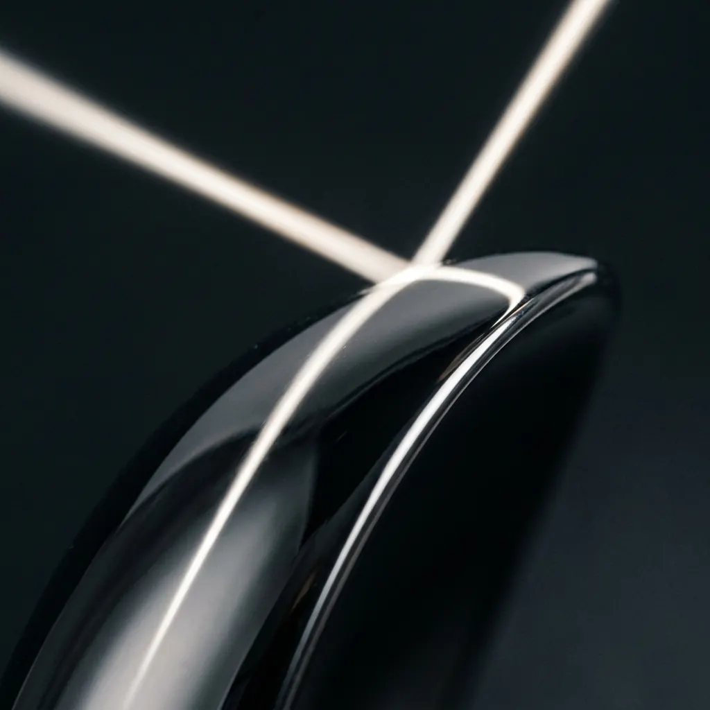 Sleek Curved Metallic Shield Surface